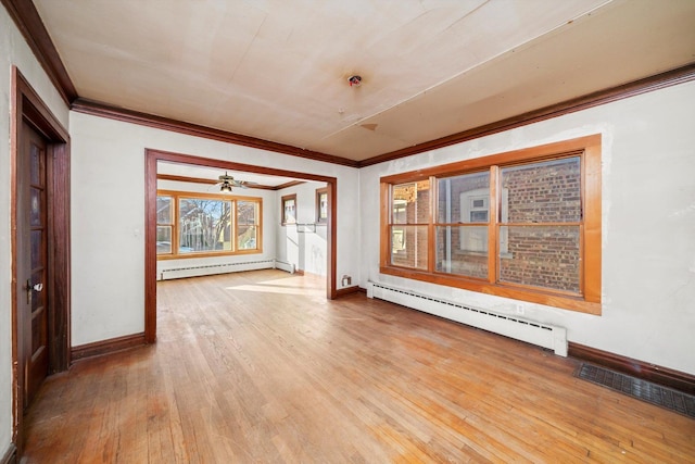 7424 W 57th Pl, Summit, IL 60501 - empty room featuring baseboard heating, ornamental molding, hardwood / wood-style floors, baseboards, and a ceiling fan