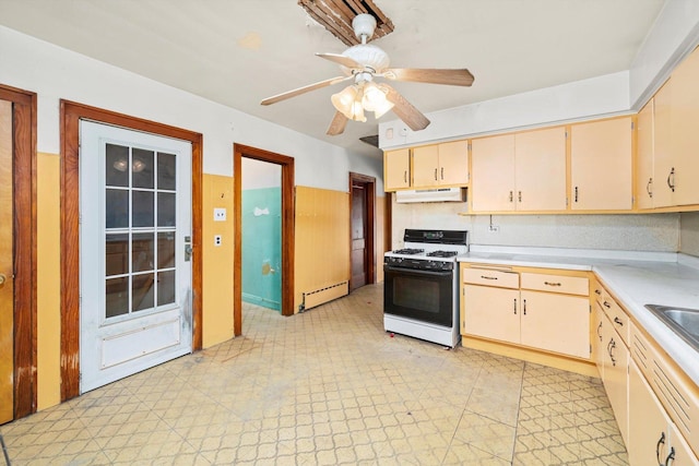 7424 W 57th Pl, Summit, IL 60501 - kitchen with gas stove, under cabinet range hood, a baseboard radiator, light countertops, and light floors