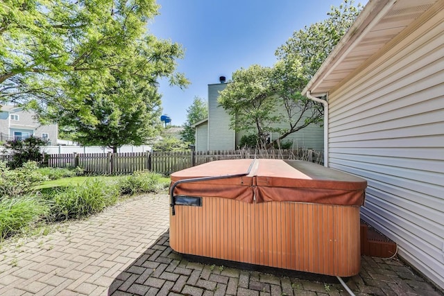 2512 Fox Meadow Dr, Crest Hill, IL 60403 - fenced backyard featuring a hot tub and a patio area