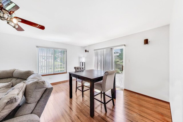 2512 Fox Meadow Dr, Crest Hill, IL 60403 - dining room with healthy amount of natural light, light wood-type flooring, baseboards, and ceiling fan