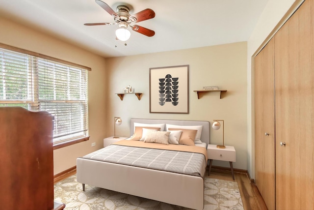 2512 Fox Meadow Dr, Crest Hill, IL 60403 - bedroom featuring a closet, baseboards, wood finished floors, and a ceiling fan