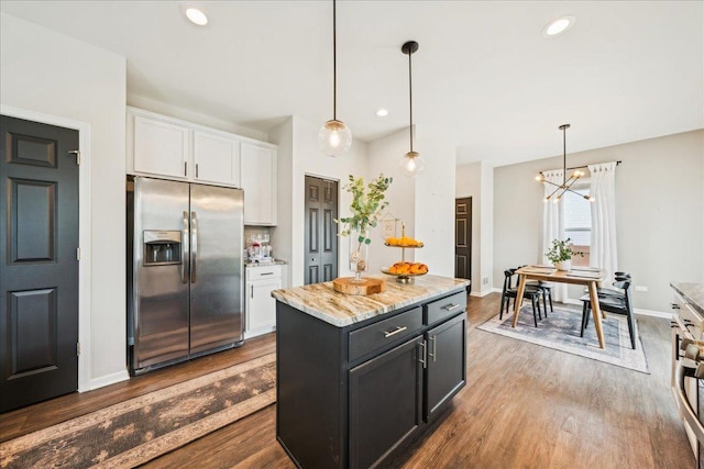 26143 S White Oak Trl, Channahon, IL 60410 - kitchen with stainless steel refrigerator with ice dispenser, white cabinetry, dark wood-style flooring, light stone countertops, and recessed lighting