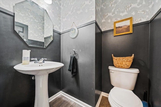 26143 S White Oak Trl, Channahon, IL 60410 - bathroom featuring toilet, baseboards, and wood finished floors