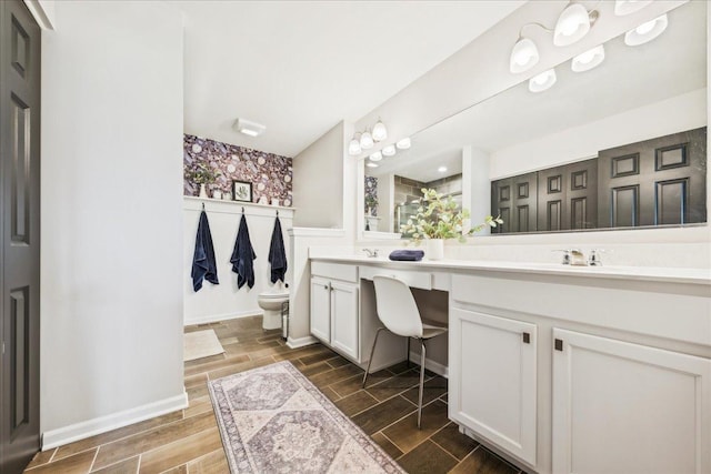 26143 S White Oak Trl, Channahon, IL 60410 - bathroom with double vanity, toilet, and wood finish floors