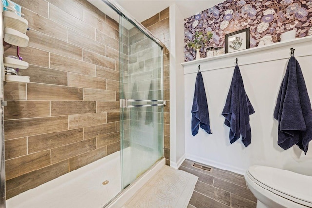 26143 S White Oak Trl, Channahon, IL 60410 - bathroom with a shower stall, baseboards, and toilet