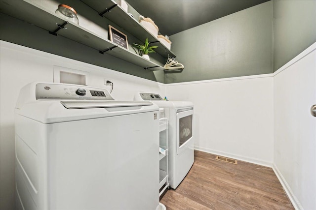 26143 S White Oak Trl, Channahon, IL 60410 - laundry room with washing machine and dryer, wood finished floors, and baseboards