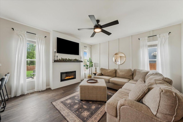 26143 S White Oak Trl, Channahon, IL 60410 - living area with a ceiling fan, wood finished floors, a glass covered fireplace, and baseboards
