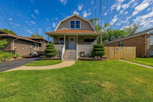 5844 W Maple Ave, Berkeley, IL 60163 - view of front of house with a gambrel roof, covered porch, and central AC unit