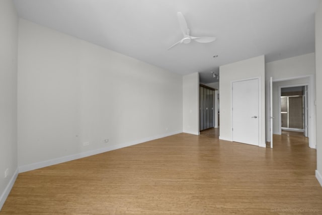1322 N Clybourn Ave Unit 4S, Chicago, IL 60610 - spare room featuring light wood-type flooring, a ceiling fan, and baseboards