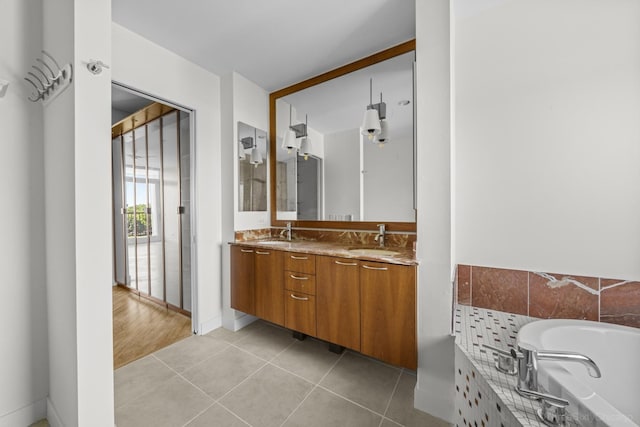 1322 N Clybourn Ave Unit 4S, Chicago, IL 60610 - bathroom with double vanity, a bath, and tile patterned floors