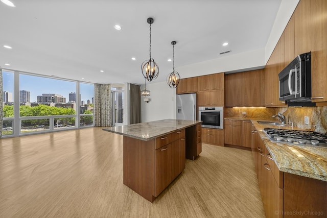 1322 N Clybourn Ave Unit 4S, Chicago, IL 60610 - kitchen with stainless steel appliances, modern cabinets, brown cabinets, tasteful backsplash, and recessed lighting
