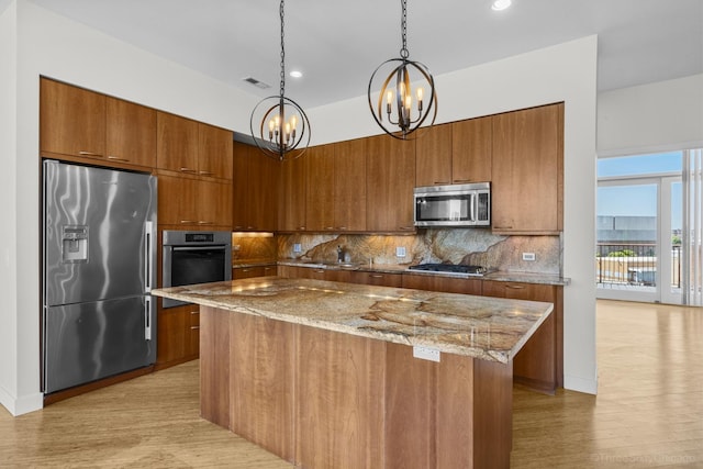 1322 N Clybourn Ave Unit 4S, Chicago, IL 60610 - kitchen with appliances with stainless steel finishes, brown cabinets, a chandelier, and recessed lighting