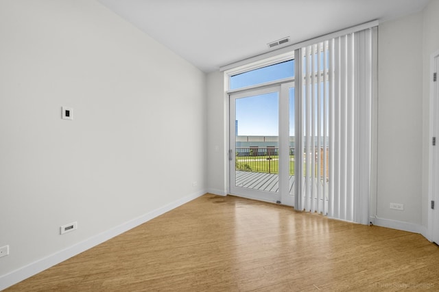 1322 N Clybourn Ave Unit 4S, Chicago, IL 60610 - empty room with healthy amount of natural light, baseboards, and wood finished floors