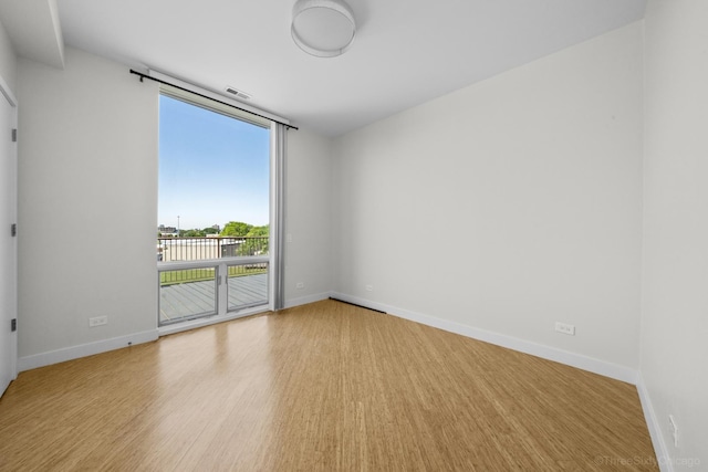 1322 N Clybourn Ave Unit 4S, Chicago, IL 60610 - spare room featuring baseboards and wood finished floors