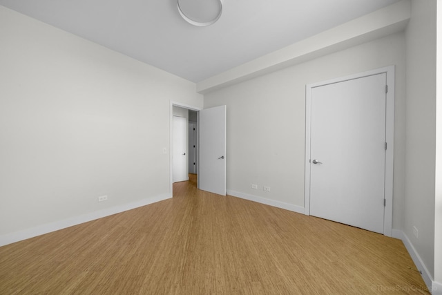 1322 N Clybourn Ave Unit 4S, Chicago, IL 60610 - unfurnished bedroom featuring baseboards and light wood-style floors