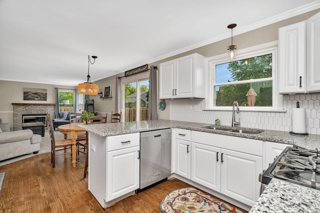 633 Salem Cir, Oswego, IL 60543 - kitchen with dishwasher, a sink, tasteful backsplash, light wood-style floors, and white cabinetry