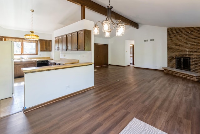 26 Marina Dr, Des Plaines, IL 60016 - kitchen featuring freestanding refrigerator, open floor plan, a sink, dishwasher, and light countertops