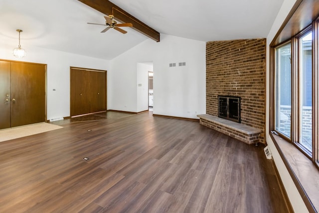 26 Marina Dr, Des Plaines, IL 60016 - unfurnished living room with healthy amount of natural light, a ceiling fan, dark wood-style floors, and a fireplace