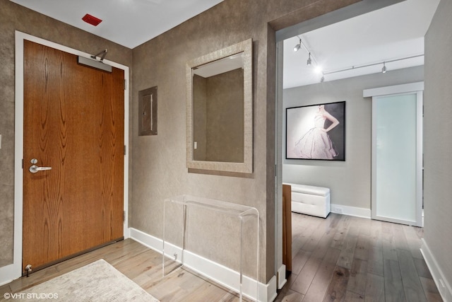 2 E Erie St Unit 1605, Chicago, IL 60611 - corridor featuring hardwood / wood-style floors, baseboards, electric panel, and track lighting