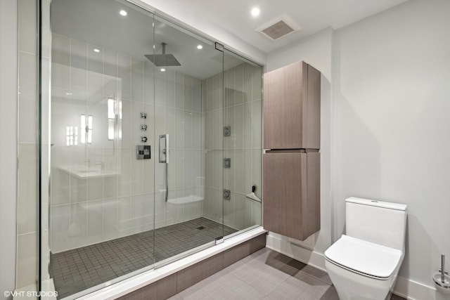 2 E Erie St Unit 1605, Chicago, IL 60611 - bathroom featuring a stall shower, toilet, recessed lighting, and baseboards