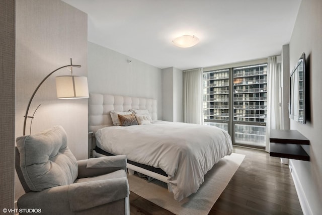 2 E Erie St Unit 1605, Chicago, IL 60611 - bedroom with wood finished floors, access to exterior, and baseboards