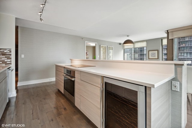2 E Erie St Unit 1605, Chicago, IL 60611 - kitchen with modern cabinets, wine cooler, stainless steel oven, dark wood-style flooring, and light countertops