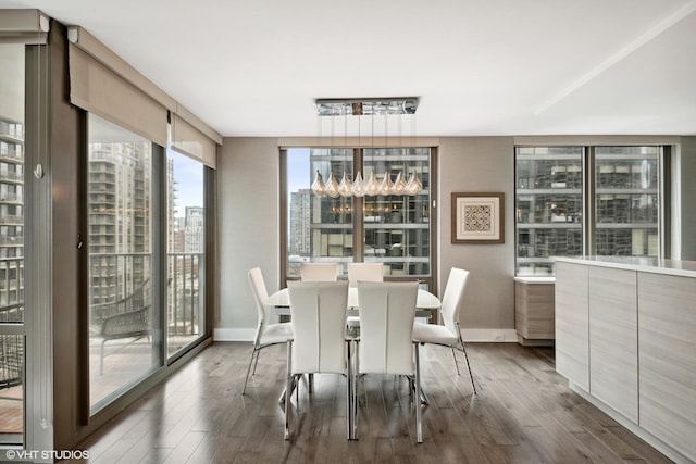 2 E Erie St Unit 1605, Chicago, IL 60611 - dining room with a city view, dark wood-style floors, and baseboards