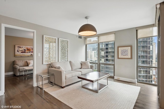 2 E Erie St Unit 1605, Chicago, IL 60611 - living room with hardwood / wood-style floors, expansive windows, and baseboards