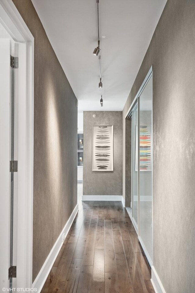2 E Erie St Unit 1605, Chicago, IL 60611 - hall featuring track lighting, wood-type flooring, and a textured wall
