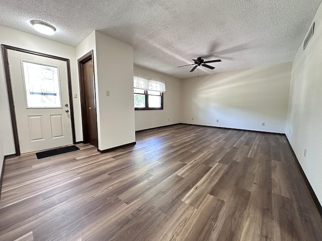 600 E 7th St, Rock Falls, IL 61071 - foyer entrance with ceiling fan, wood finished floors, a textured ceiling, and baseboards