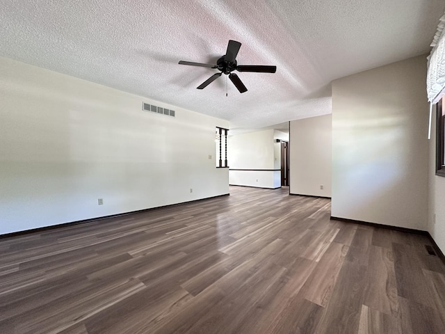 600 E 7th St, Rock Falls, IL 61071 - empty room with a textured ceiling, ceiling fan, wood finished floors, and baseboards