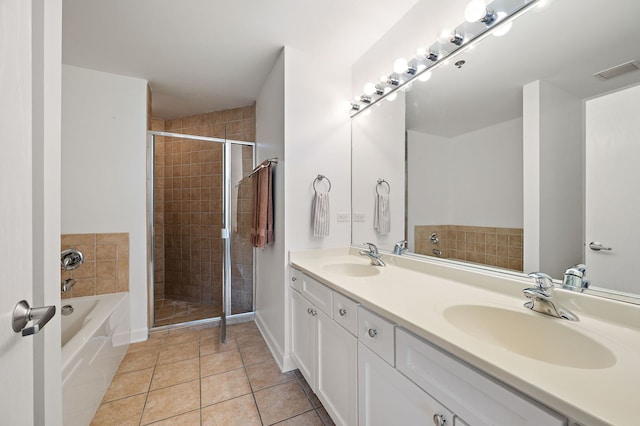 1529 S State St Unit 13G, Chicago, IL 60605 - bathroom with a bath, double vanity, a stall shower, and tile patterned floors