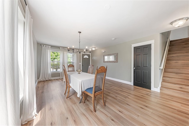 15905 Rolland Dr, Manhattan, IL 60442 - dining area with a chandelier, healthy amount of natural light, baseboards, and light wood-style flooring