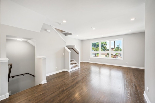 3638 S Western Ave Unit E, Chicago, IL 60609 - empty room featuring wood finished floors, stairs, recessed lighting, and baseboards