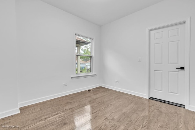 8127 S Jeffery Blvd, Chicago, IL 60617 - empty room with wood finished floors and baseboards