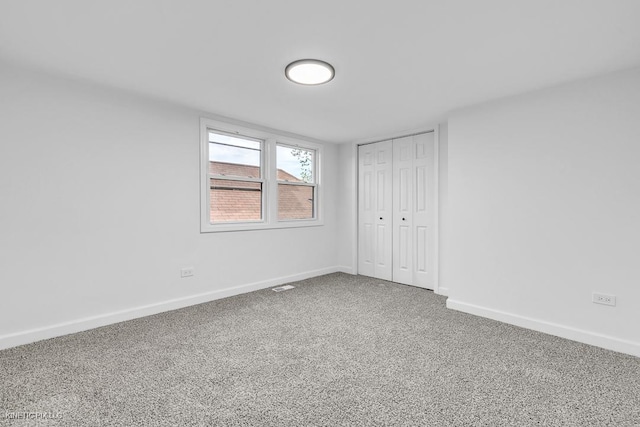 8127 S Jeffery Blvd, Chicago, IL 60617 - unfurnished bedroom featuring carpet flooring, baseboards, and a closet
