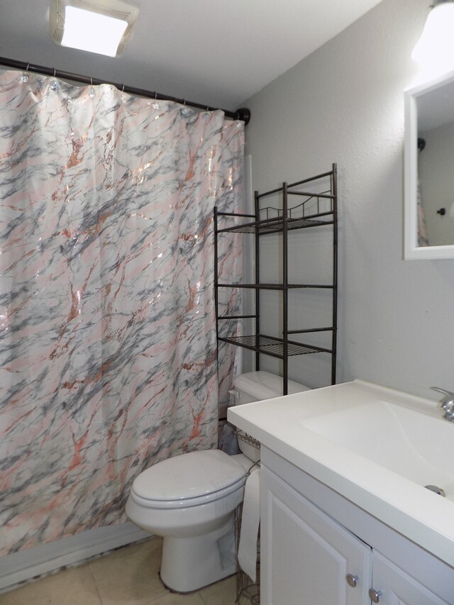 7818 Mildred Rd, Machesney Park, IL 61115 - bathroom with vanity, toilet, tile patterned floors, and curtained shower