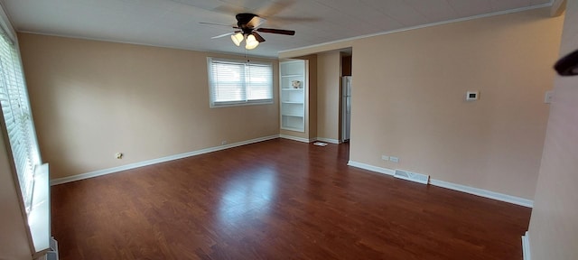 8923 S Main St, Hometown, IL 60456 - unfurnished room featuring crown molding, a ceiling fan, dark wood-style flooring, and baseboards