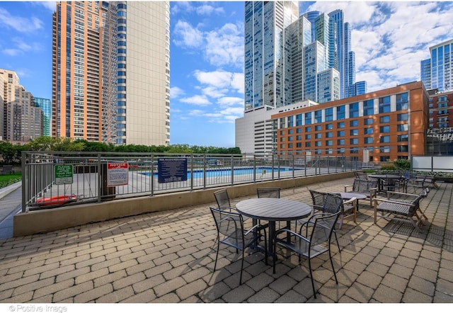 1250 S Michigan Ave Unit 702, Chicago, IL 60605 - view of patio featuring a view of city and a community pool