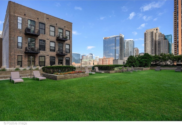 1250 S Michigan Ave Unit 702, Chicago, IL 60605 - view of community featuring a skyline view and a lawn