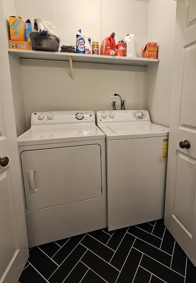 1730 Hinman Ave Unit 4F, Evanston, IL 60201 - washroom with washing machine and clothes dryer and dark tile patterned flooring