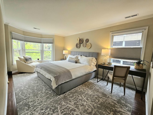 1730 Hinman Ave Unit 4F, Evanston, IL 60201 - bedroom with multiple windows, crown molding, wood finished floors, and baseboards