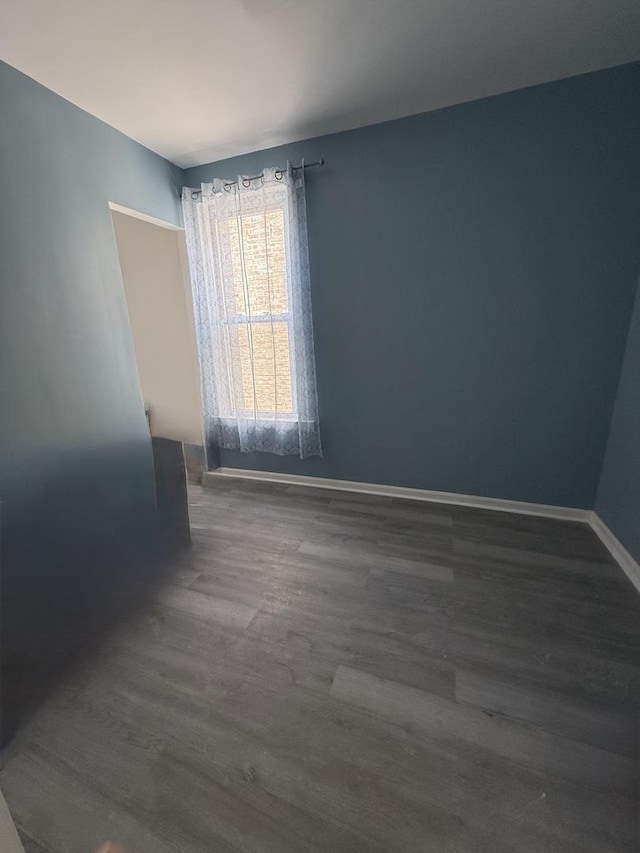 1435 S 57th Ave, Cicero, IL 60804 - unfurnished room featuring dark wood-style flooring and baseboards