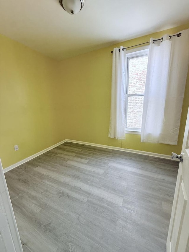 1435 S 57th Ave, Cicero, IL 60804 - unfurnished room with wood finished floors and baseboards