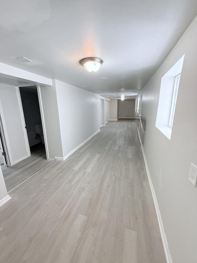1435 S 57th Ave, Cicero, IL 60804 - finished basement with light wood-style floors and baseboards