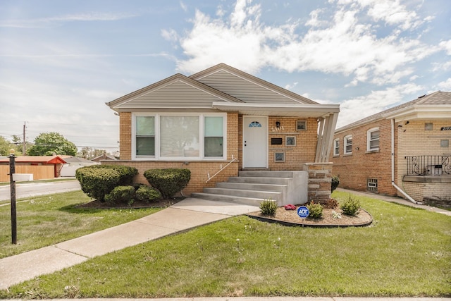 2101 W 82nd Pl, Chicago, IL 60620 - view of front facade with brick siding and a front yard