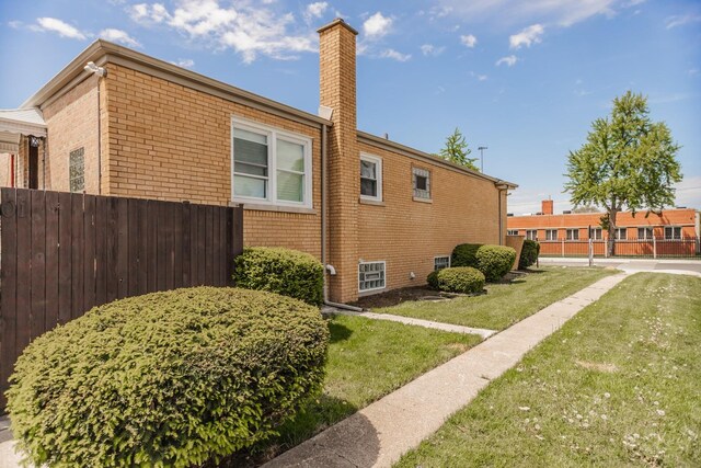 2101 W 82nd Pl, Chicago, IL 60620 - view of side of home featuring a chimney and brick siding
