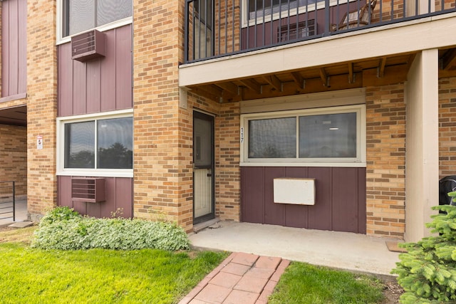 1320B Lore Ln Unit 117, Lombard, IL 60148 - doorway to property with a balcony and brick siding