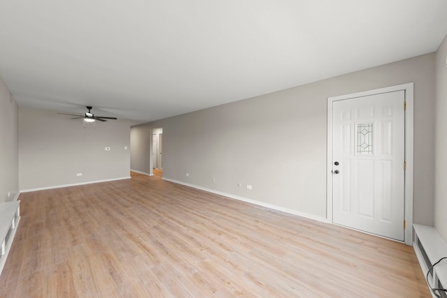1320B Lore Ln Unit 117, Lombard, IL 60148 - unfurnished living room with a ceiling fan, light wood-type flooring, baseboards, and a baseboard radiator