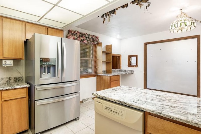 1322 Empire Ct, Freeport, IL 61032 - kitchen with stainless steel fridge with ice dispenser, white dishwasher, light tile patterned floors, backsplash, and brown cabinets